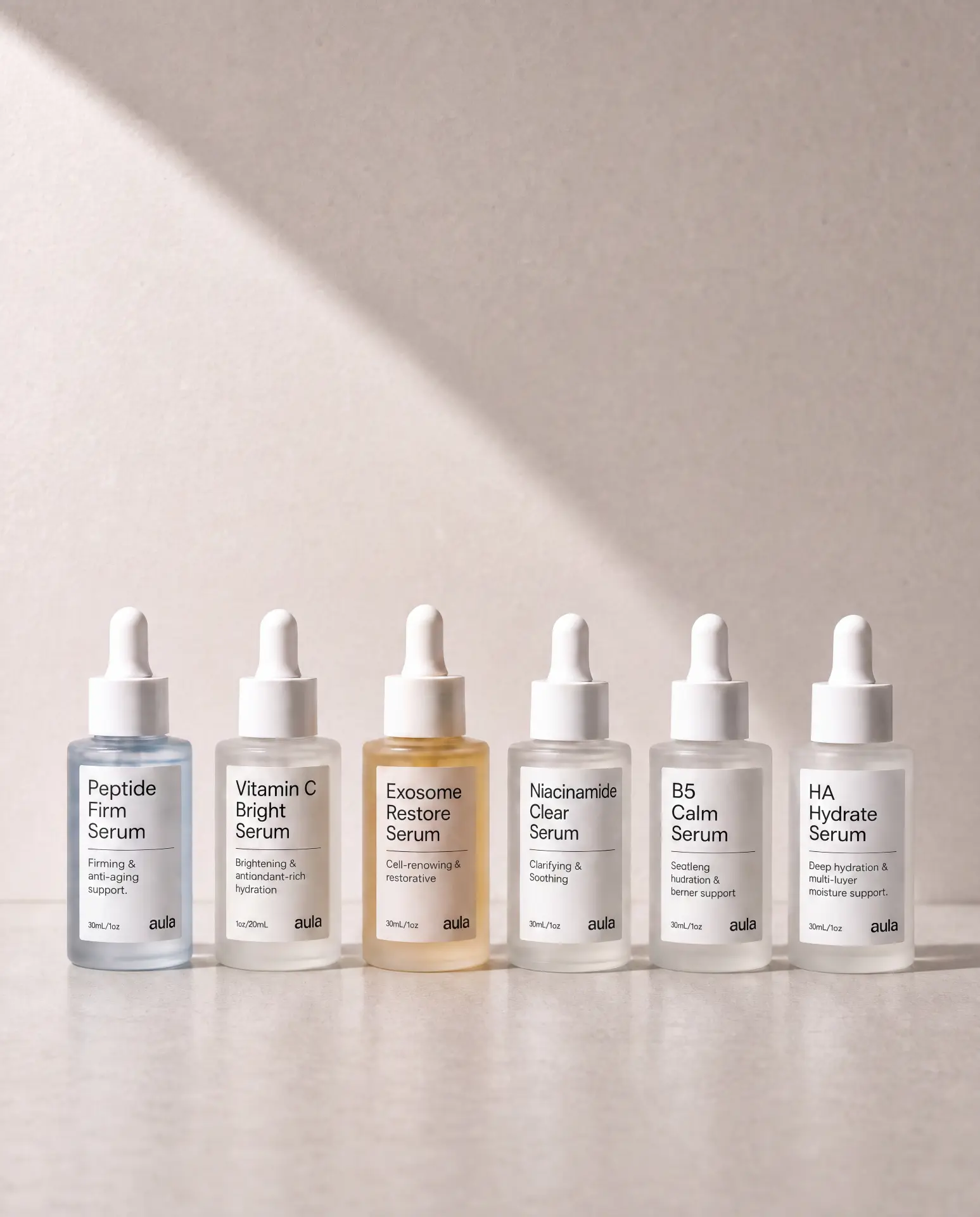 The six AULA precision serums lined up in sunlight